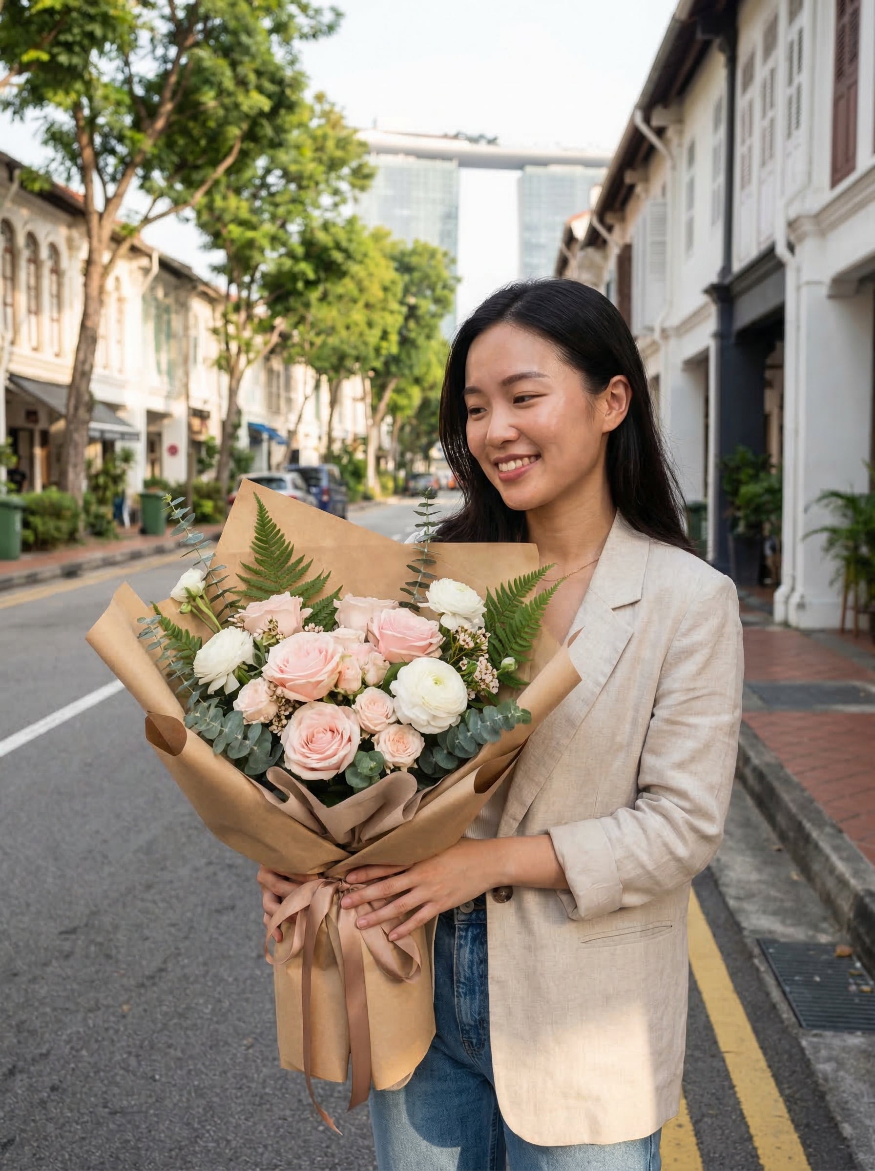 Lifestyle: model holding same-day bouquet